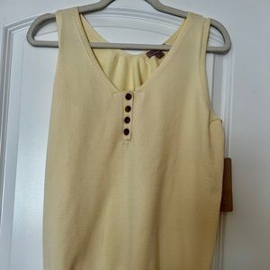 Brand new sweater tank in vanilla color with brown wooden like buttons.